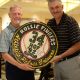 Featured celebrity Rollie Fingers poses with Phil Navertil who bid on a custom, hand carved plaque made for the event.